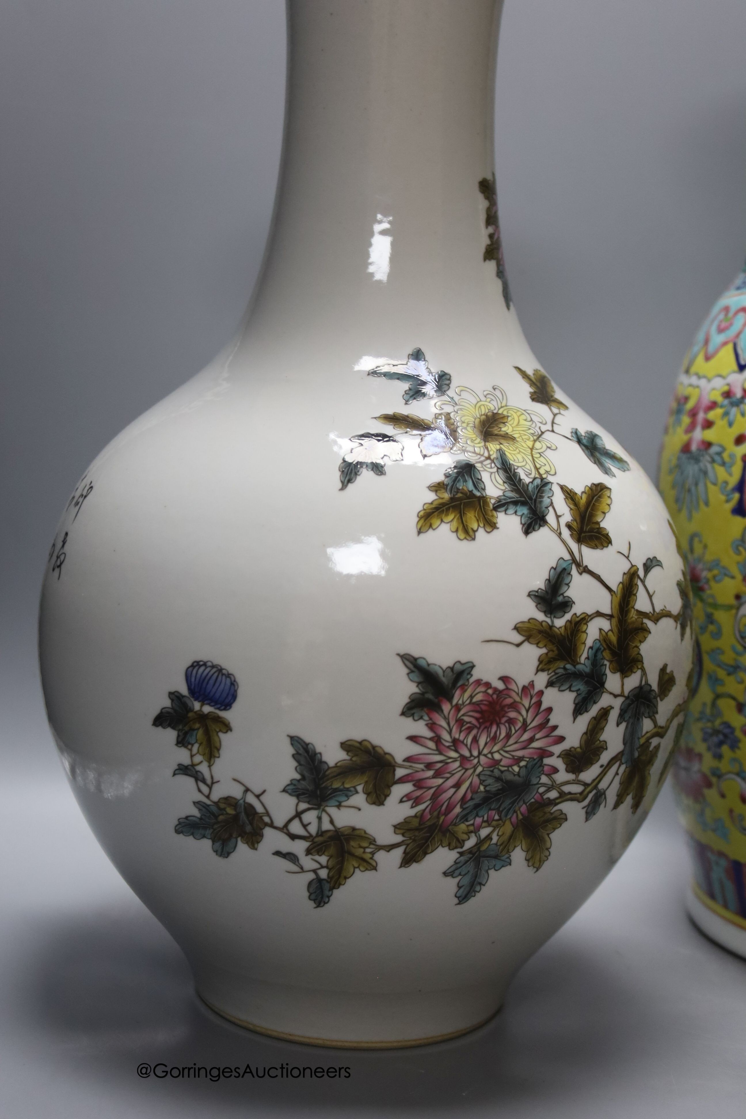 A Chinese yellow ground vase and another painted with chrysanthemums, tallest 46cm